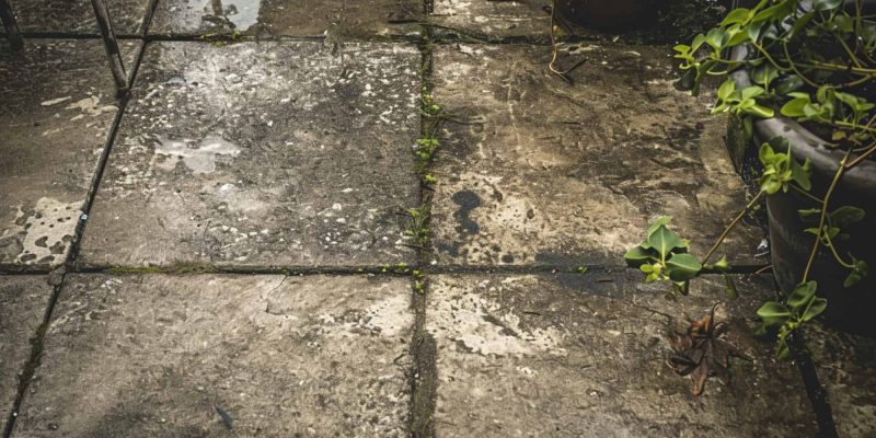 a dirty concrete patio